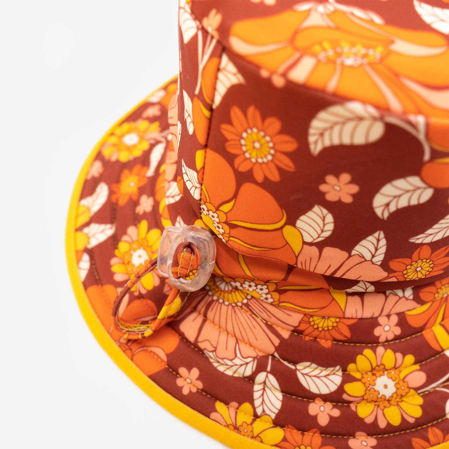Pipi Swimwear flower pattern and yellow reversible wide brim hat with adjustable head toggle