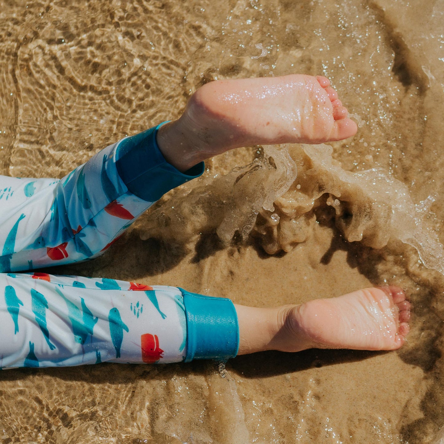 Close up of ankle cuff on Pipi Swimwear narwhal full length sunsuit