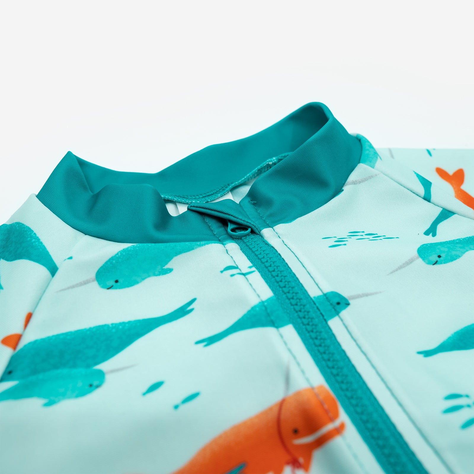 Close up of neckline on Pipi Swimwear narwhal full coverage sunsuit 