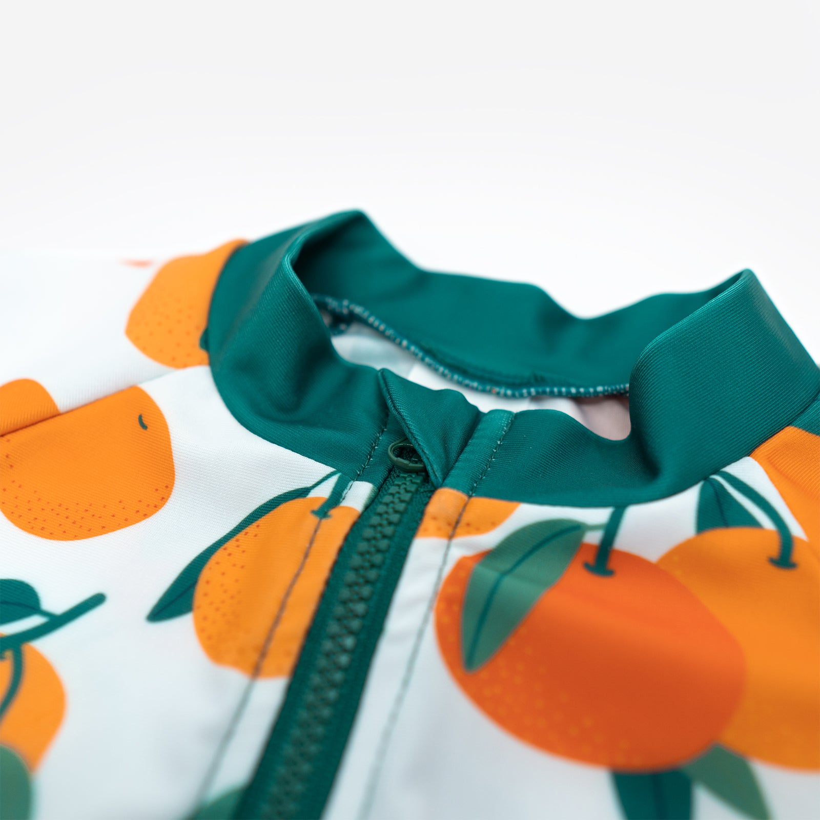 Close up of neckline of Pipi Swimwear citrus fruit pattern full length sunsuit 
