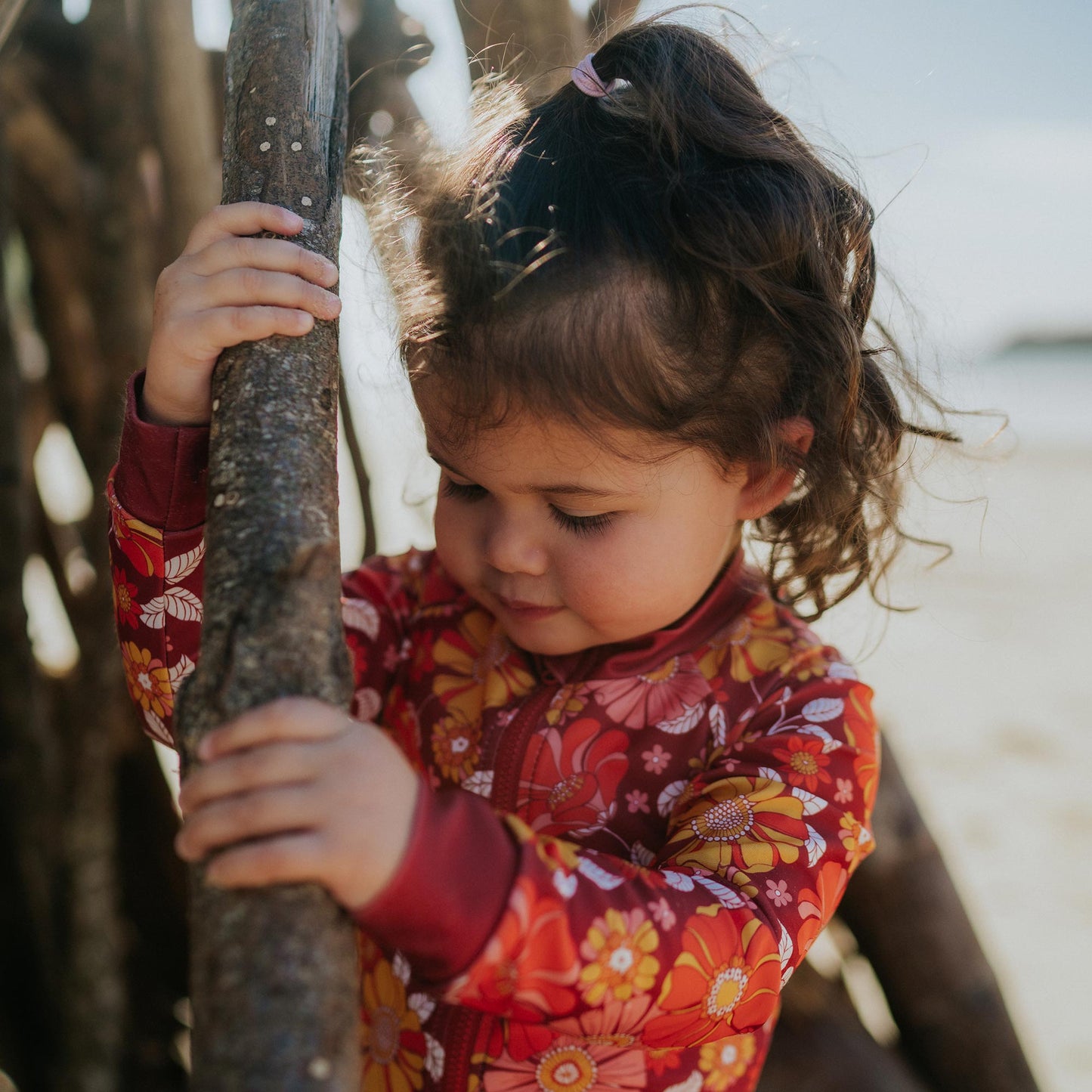 Toddler wearing Pipi Swimwear floral full length sunsuit 